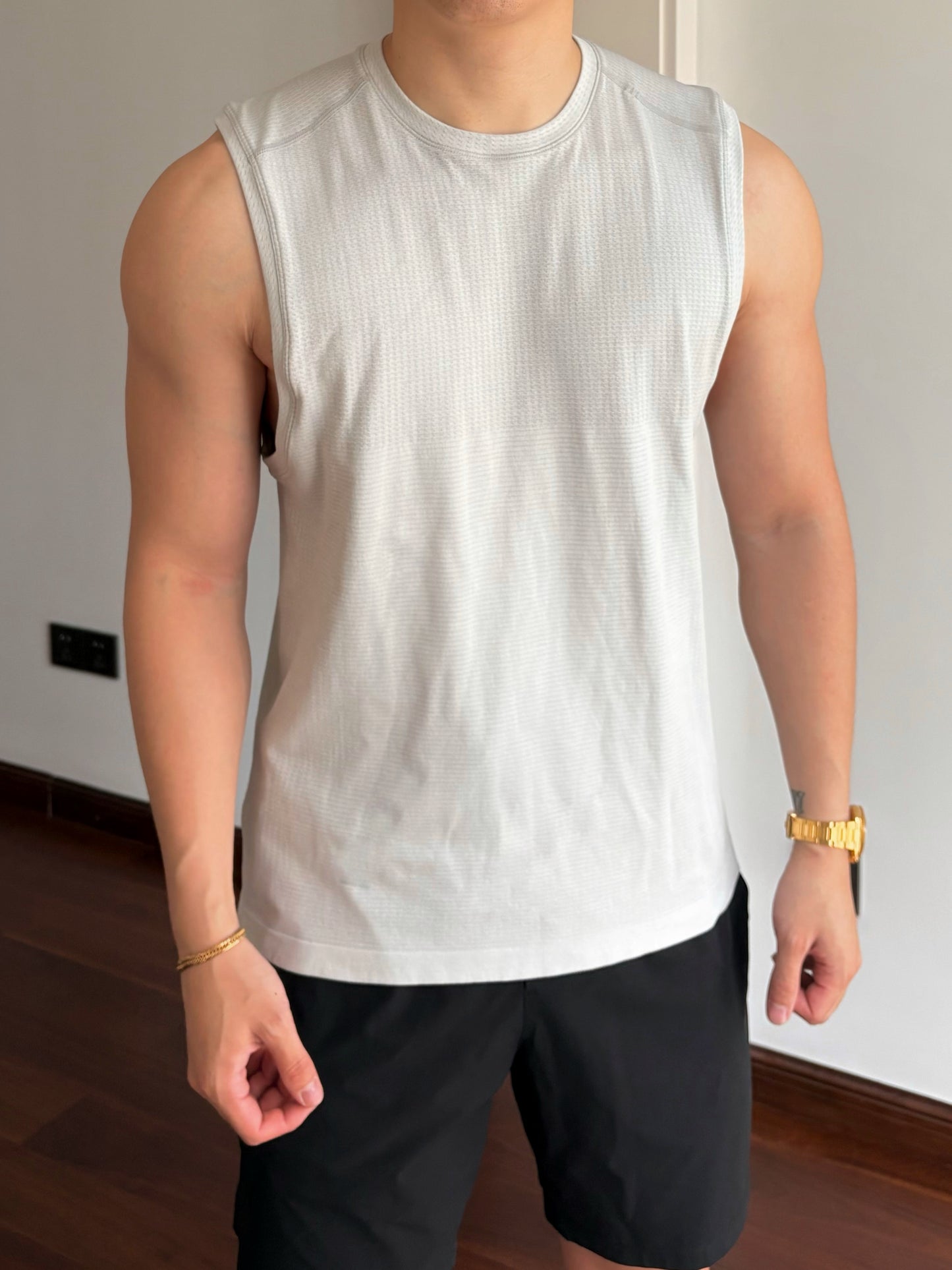 white MVT sleeveless shirt  